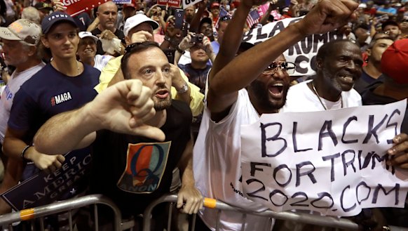 QAnon followers at Donald Trump's Tampa rally on Tuesday.