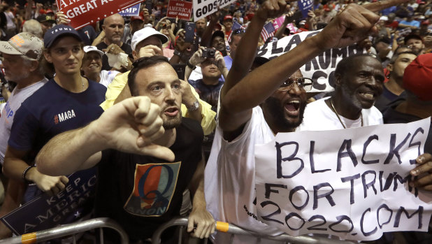 QAnon followers at Donald Trump's Tampa rally on Tuesday.