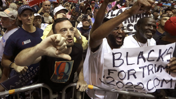 QAnon followers at Donald Trump's Tampa rally on Tuesday.