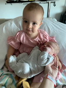 Molly Wrigley with her new baby brother Angus who was born on December 17.