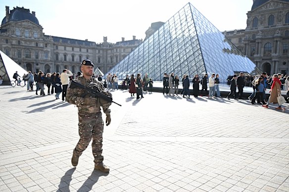 A soldier patrols in the courtyard of the Louvre museum on Thursday.