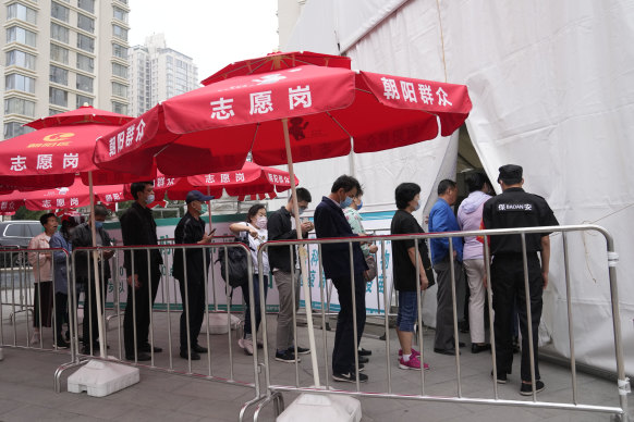 Residents line up outside a vaccination centre in Beijing this week.