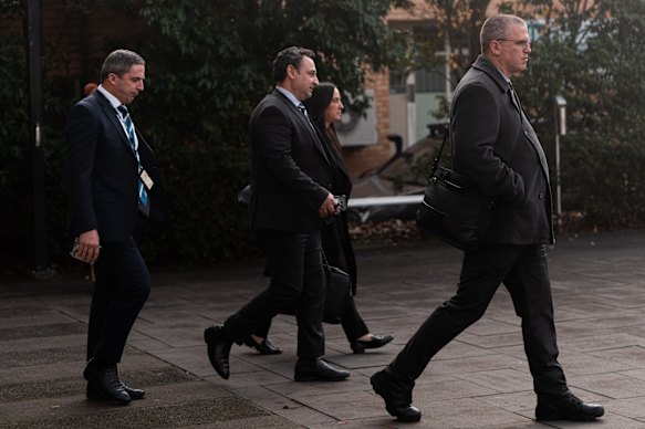 Detectives (from left) David Martin-Alcaide, Nigel L’Estrange and Stephen Eppingstall leave the Latrobe Valley Law Courts in early July.