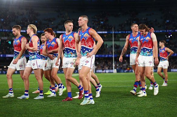 The Bulldogs trudge off after the loss to Carlton.