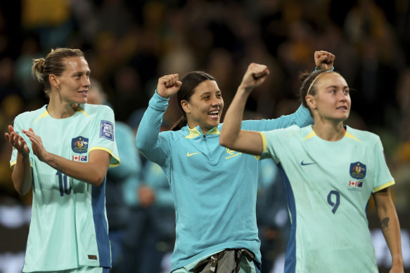 Emily van Egmond, Sam Kerr and Caitlin Foord celebrate the win against Canada.