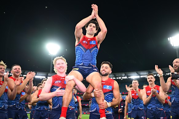 Christian Petracca is chaired off after a victory in his 200th AFL game.