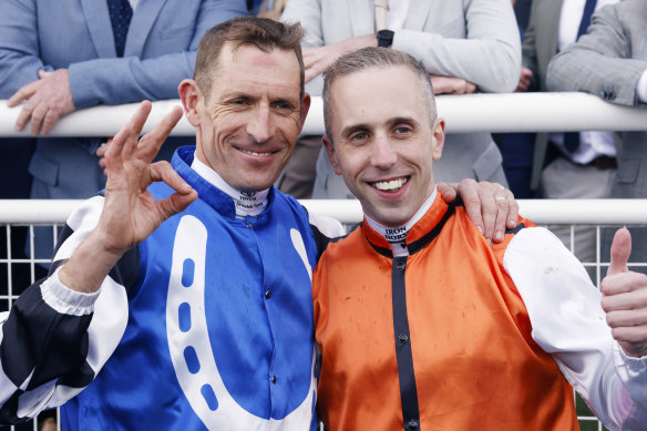 Brenton Avdulla and Hugh Bowman pose for photos after finishing in a dead heat on Ellsberg and Top Ranked in the TAB Epsom.