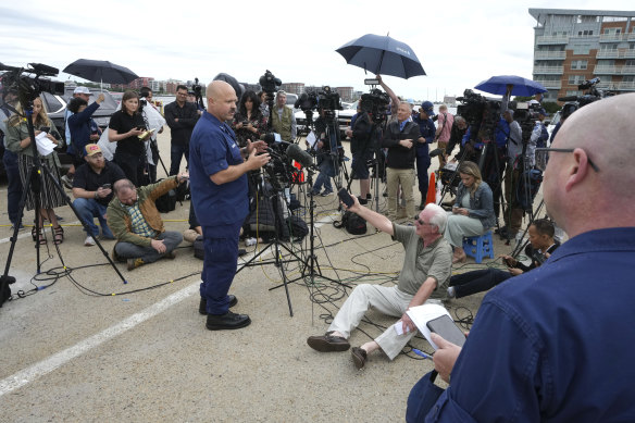 US Coast Guard captain Jamie Frederick speaks to the assembled media in Boston. 