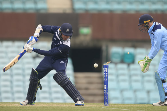 Victoria batter Todd Murphy is bowled by Tanveer Sangha.