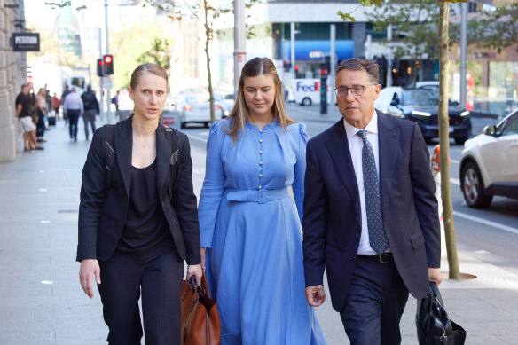 Brittany Higgins (centre) arrives at the Perth Supreme Court alongside lawyers Leon Zwier and Teresa Ward for a mediation session with former boss Linda Reynolds.