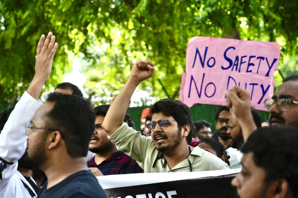 Doctors and paramedics protesting against the rape and killing of a trainee doctor at a government hospital in Kolkata gather in front of the Indian health minister’s office, in New Delhi on Monday.