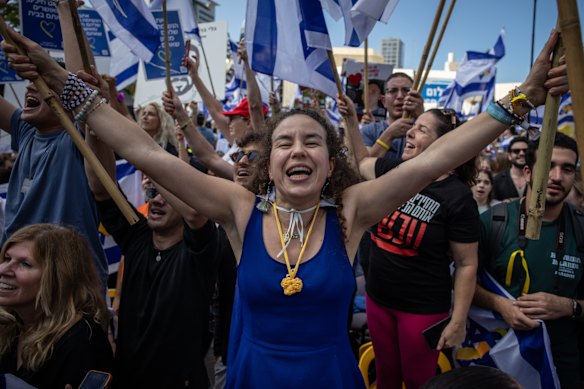 People in Tel Aviv sing and cheer at the release of the Israeli hostages.