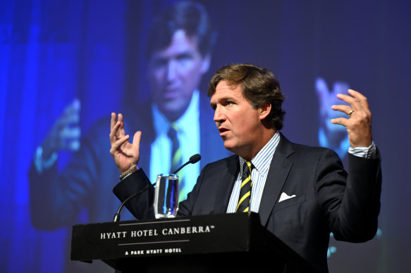 Tucker Carlson addresses a crowd, including federal MPs, at an event in Canberra on Tuesday.