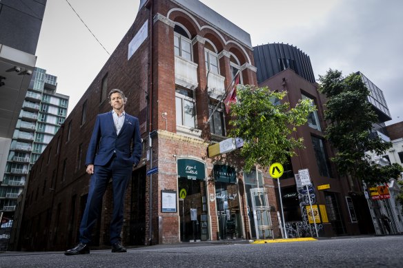 Deputy Lord Mayor Nicholas Reece in front of the Swiss club, at 87-89 Flinders Lane, which received heritage protection. 