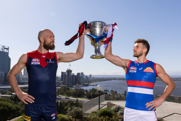 The Demons’ Max Gawn and Marcus Bontempelli of the Bulldogs with the premiership cup before last year’s big match in Perth.