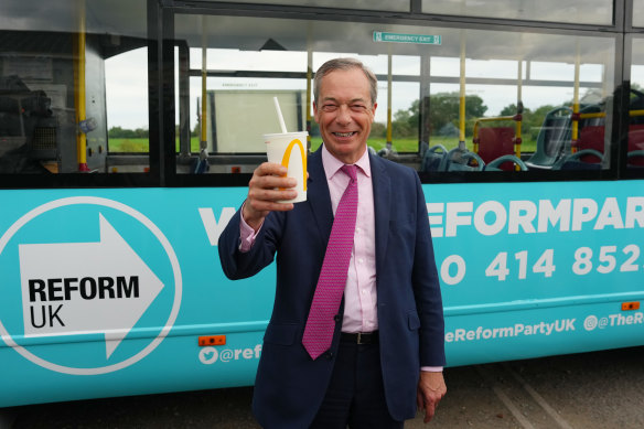 Nigel Farage holds a milkshake after the incident.