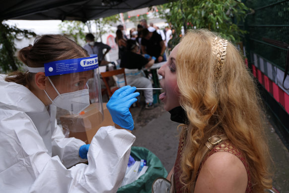 A participant submits for an express PCR test outside the KiKat Club in Berlin. 