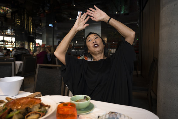 Artist Lindy Lee describing her artwork over a lunch at XOPP by Golden Century.