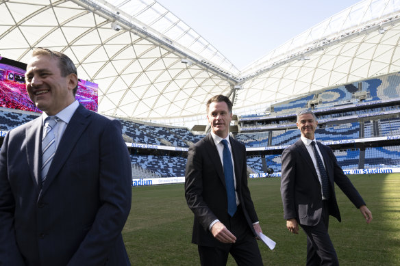 NSW Premier Chris Minns with ministers Steve Kamper, left, and John Graham, right, at Allianz Stadium