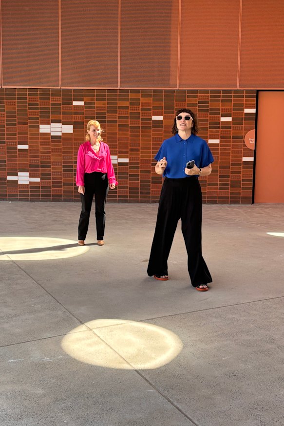 Architect Gabrielle Pelletier, an associate director of Sam Crawford Architects, with artist Sonia van de Haar, creative director of Lymesmith, look up at the circular skylights at the Willowdale Sports Precinct.