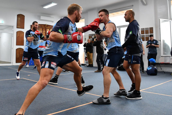 On the front foot: Matt Prior gets stuck in to a boxing workout on Tuesday.