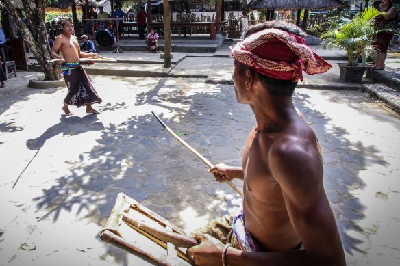 Sasak villagers stick fighting.