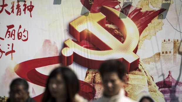 A banner featuring the hammer-and-sickle emblem is displayed in Shanghai, China.