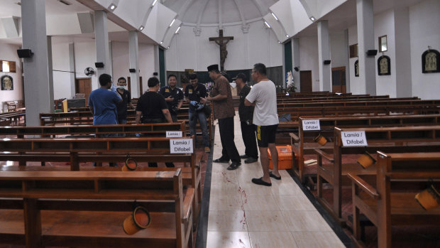 Blood stains the aisle at the Yogyakarta church.