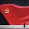 A man walks near a large sculpture of the Communist Party flag at the Chinese Communist Party History Exhibition in Beijing, China.