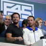 Mark Wahlberg with F45 CEO and co-founder Adam Gilchrist at the 2021 NYSE float with Greg Norman in the background.