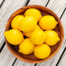 Lemons look pretty stored in a bowl, but last longer in the fridge.