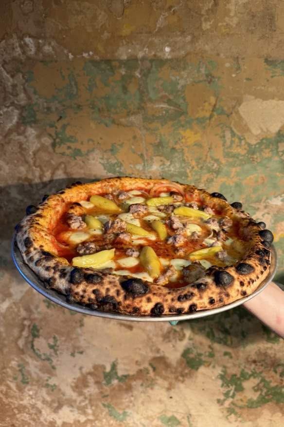 Pizza with sausage and pickled peppers. 