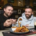 Cammy Millar and Sean Coughlan share Shea’s Irish pub spice bag.