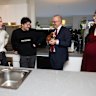 Home owners Abbey Wood and Lachlan Baker together with their dog Chilli, meet with Prime Minister Anthony Albanese and Member for Canberra Alicia Payne, during their visit to their home in the Canberra suburb of Lawson, on Monday.