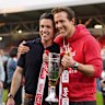 WREXHAM, WALES - APRIL 26: Rob McElhenney and Ryan Reynolds, co-owners of Wrexham AFC, pose for a photo with the trophy following the club’s promotion to the Sky Bet Championship during the Sky Bet League One match between Wrexham AFC and Charlton Athletic FC at Racecourse Ground on April 26, 2025 in Wrexham, Wales. (Photo by Kya Banasko/Getty Images)