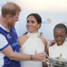 Meghan, with husband Prince Harry, at a charity polo match event.