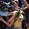 Mourners embrace at the Bondi memorial.