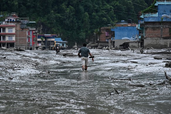A resident after the flash floods hit Devighat in Nepal.