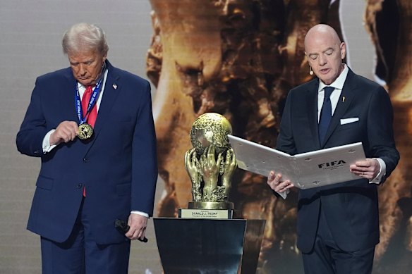 FIFA president Gianni Infantino, right, presenting US President Donald Trump with the inaugural FIFA Peace Price during the draw for the 2026 World Cup. 