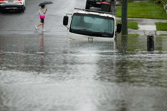 A truck partly submerged due to flash flooding in Brisbane on Sunday.