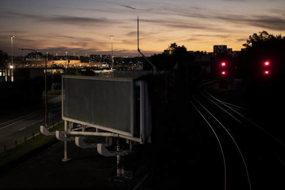 Many advertising billboards now lie empty surrounding Sydney Airport. Despite its challenges investors see it as a prime asset.