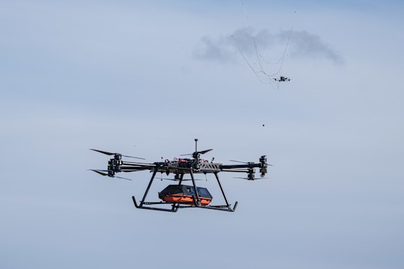 The StarGate drone, equipped with a medical module, deploys a net designed to intercept aerial threats.
