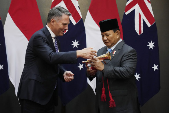 Prabowo Subianto receiving souvenirs from Deputy Prime Minister Richard Marles.