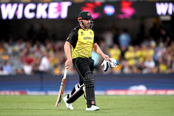 Aaron Finch walks off after making 63 but tweaking his hamstring against Ireland.