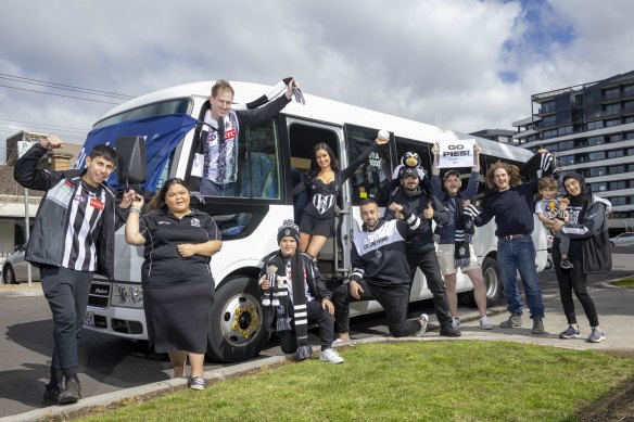 Collingwood fans prepare to board a bus bound for Sydney and Saturday’s grand final qualifier.