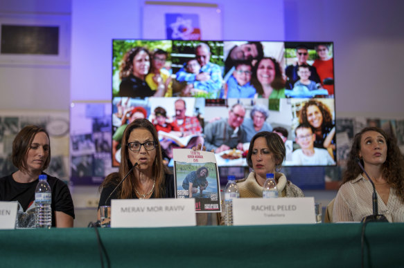 Merav Mor Raviv, centre left, and others in front of photos of Israeli relatives believed to be held hostage by Hamas, during a press conference in Madrid, Spain.