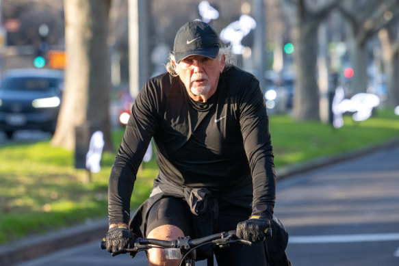 John Woodman on his bike on St Kilda Road. 