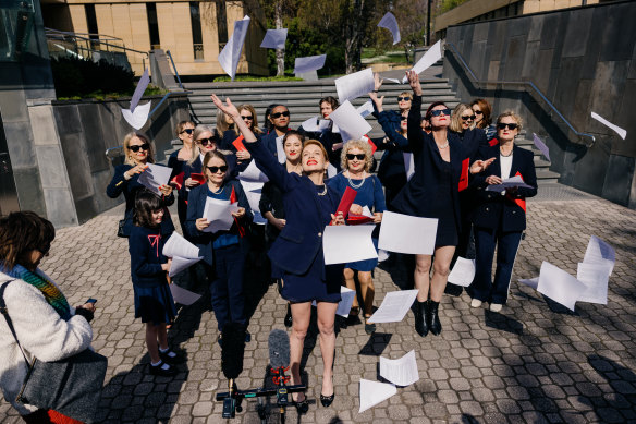 Kirsha Kaechele (centre) and supporters celebrate the Ladies Lounge Supreme Court verdict. 