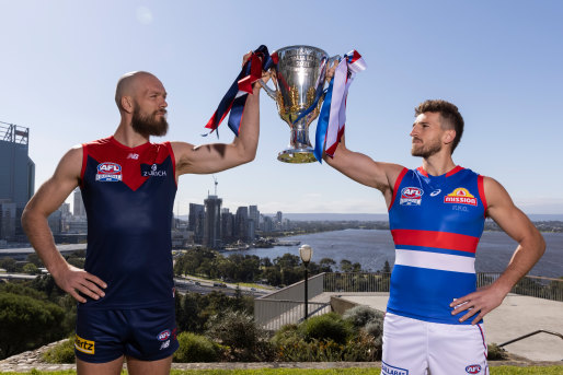 Max Gawn of the Demons and Marcus Bontempelli of the Bulldogs pose with the 2021 AFL Premiership Cup in Perth, ahead of the grand final on Saturday.