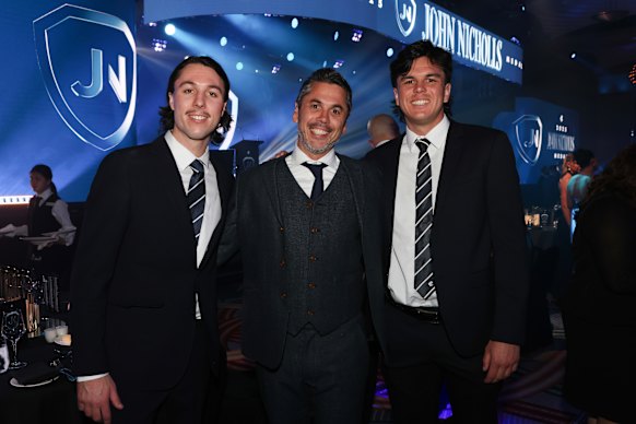 Ben Hollands (centre) with his sons Ollie (left) and Elijah (right).